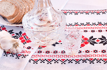 Image showing Vodka in decanter, bread and garlic 