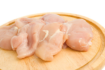 Image showing Close-up of Chicken fillet on hardboard isolated 
