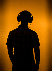 Image showing Silhouette of man with headset