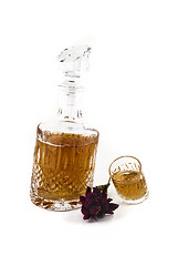 Image showing Crystal decanter with jigger and flower for alcoholic beverage