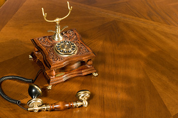 Image showing Picked up phone. Old-fashioned telephone