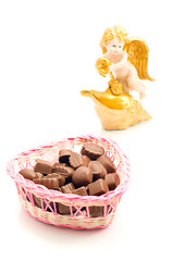 Image showing Candies in basket and angel