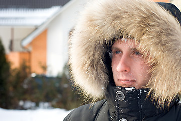 Image showing Snowball fight - man in warm jacket