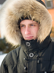 Image showing Winter - man in warm jacket with furry hood