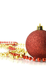 Image showing Christmas is coming. Decoration - colorful red ball and tinsel