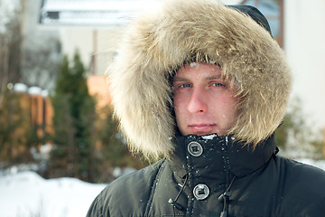 Image showing Winter - man in warm jacket with furry hood