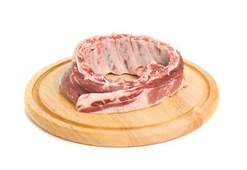 Image showing Uncooked Pork meat on round hardboard 