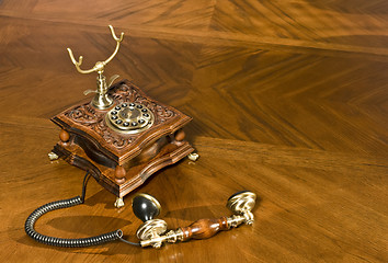 Image showing Pick up the phone. Old-fashioned telephone