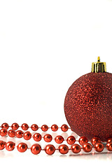 Image showing Christmas is coming. Red Decoration - ball and tinsel 