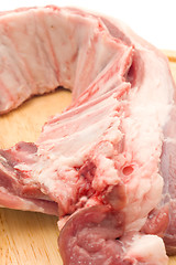 Image showing Closeup of Uncooked Pork ribs on hardboard 