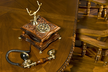 Image showing Old-fashioned telephone on table