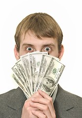 Image showing Surprised or amazed Businessman with hundreds of dollars 