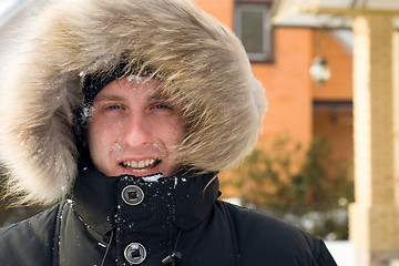 Image showing After snowball fight - man in warm jacket