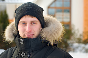 Image showing Winter - man in cap and warm jacket