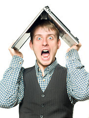 Image showing Shocked man with laptop over his head 