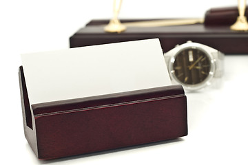 Image showing Card holder with blank white business card, watch and pens