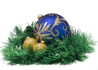 Image showing Three Beautiful Christmas or New Year balls in green tinsel 