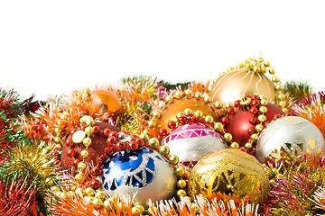 Image showing Beautiful Christmas decoration balls and colorful tinsel 