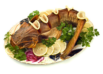 Image showing Bloated sheatfish with lemon and parsley