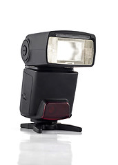 Image showing Professional flash on stand for digital camera isolated