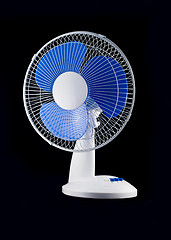 Image showing Modern desk cooling fan over black 