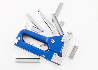 Image showing Blue staple gun with staples isolated over white 