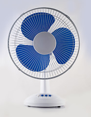 Image showing Modern desk cooling fan over white and grey