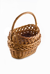 Image showing Beautiful Wicker woven basket over white 