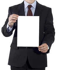 Image showing Man in suit with blank sheet of paper 