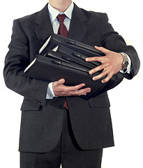 Image showing Businessman with stack of folders