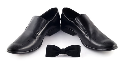 Image showing Black bow and men's classic shoes isolated