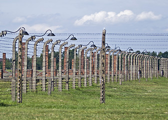 Image showing Wire fence and stoves in Birkenau concentration camp