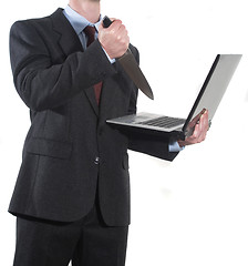 Image showing Angry Businessman stabbing notebook with a knife