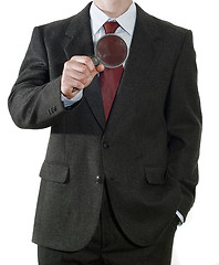 Image showing Businessman with magnifier