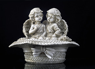 Image showing Two beautiful angels in the wattled hat