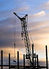 Image showing Builders in back lighting