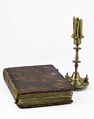 Image showing Candlestick and a book