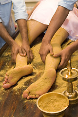 Image showing indian ayurvedic oil foot massage