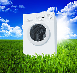 Image showing washing machine and green  field 