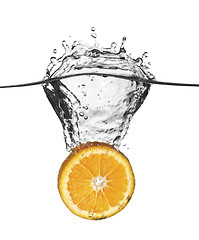 Image showing orange splash in water