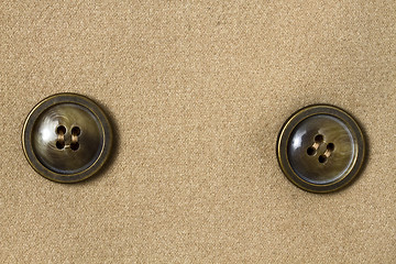 Image showing Two big buttons and fabric 