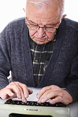 Image showing senior at typewriter