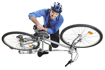 Image showing man repai his bicycle