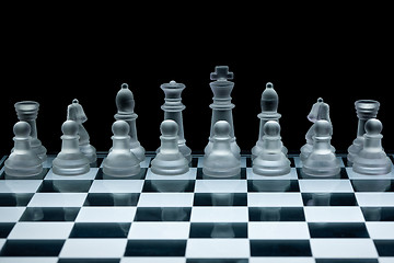 Image showing Macro shot of glass chess set against a black background