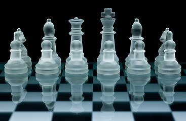Image showing Macro shot of glass chess set against a black background