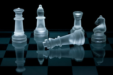 Image showing Macro shot of glass chess pieces against a black background