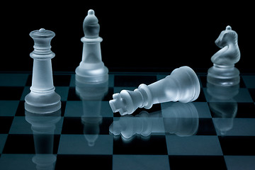 Image showing Macro shot of glass chess pieces against a black background