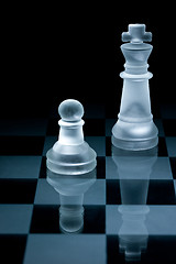 Image showing Macro shot of glass chess pieces against a black background