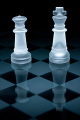 Image showing Macro shot of glass chess pieces against a black background