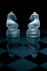 Image showing Macro shot of glass chess pieces against a black background